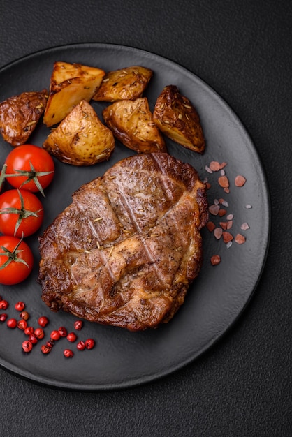 Delicious juicy pork or beef steak grilled with salt spices and herbs