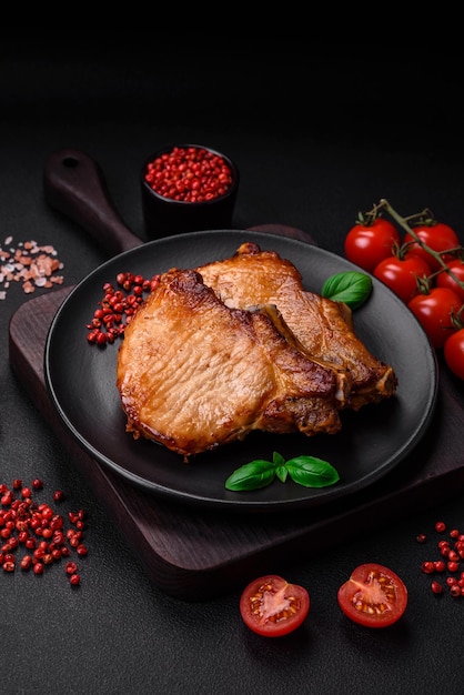 Delicious juicy pork or beef steak with salt spices and herbs