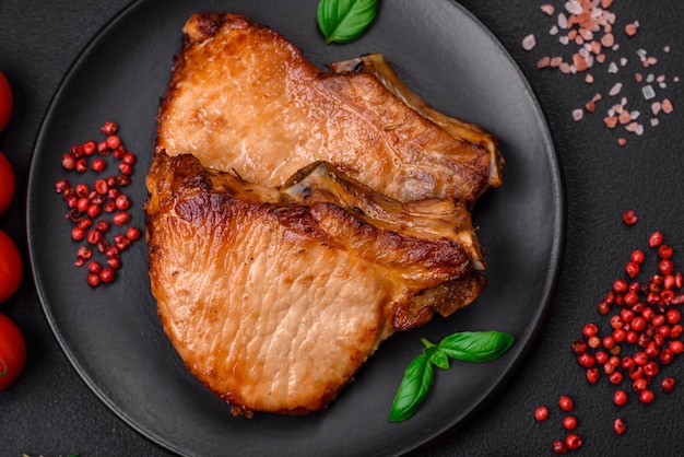 Delicious juicy pork or beef steak with salt spices and herbs