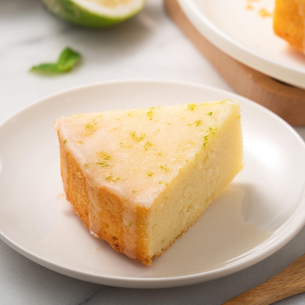 Delicious Lemon Glazed Pound Sponge cake on white marble table background