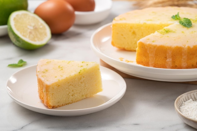 Delicious Lemon Glazed Pound Sponge cake on white marble table background