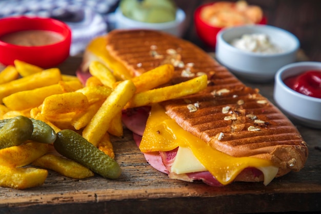 Delicious looking hot sandwich - toast. Sandwich with mixed toast, cheddar cheese and salami.