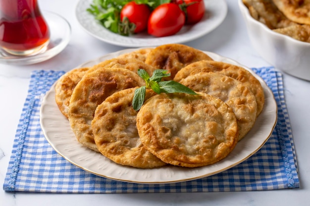 Delicious meat pie from Turkish cuisine. Fried handmade pies. Turkish name; fincan boregi or puf borek