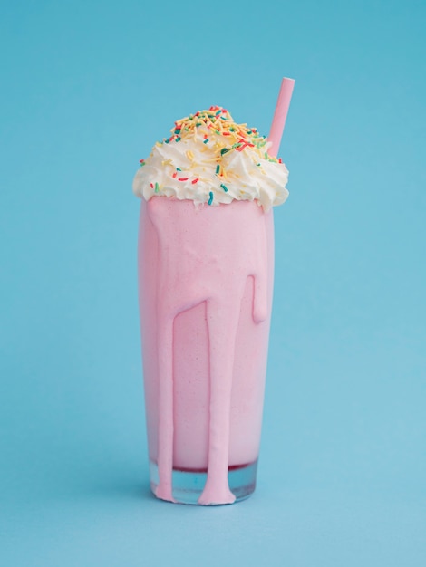 Delicious milkshake with blue background