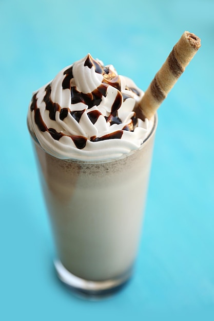 Delicious milkshake on wooden table