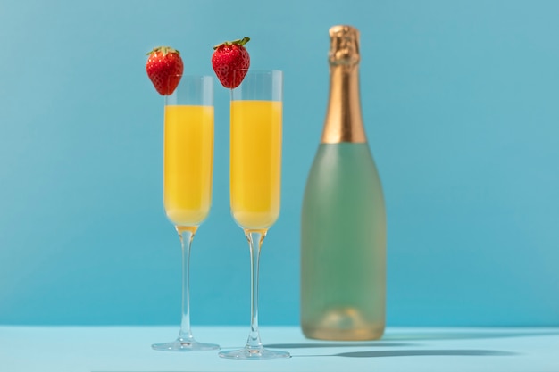 Delicious mimosa cocktail with strawberries