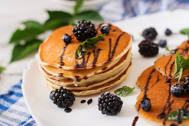 Delicious pancakes with blackberries and chocolate.