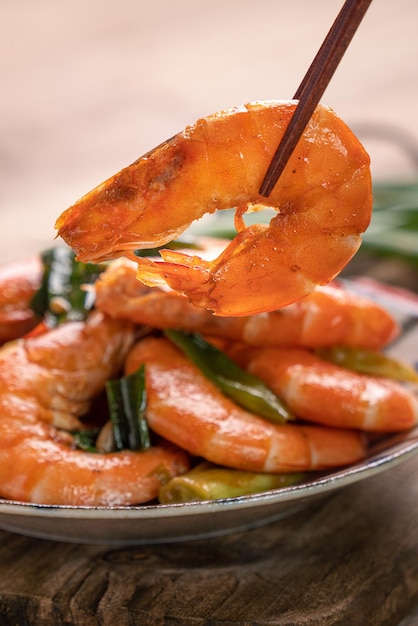 Delicious panfried shrimp on dark wooden table background