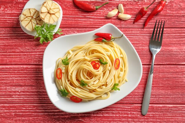 Delicious pasta with garlic and chili pepper on plate