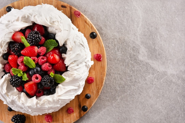 Delicious Pavlova cake with meringue topped and fresh berries