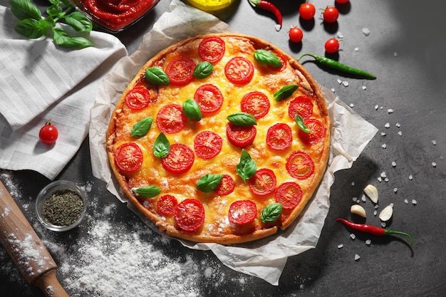 Delicious pizza on kitchen table