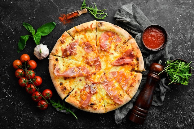 Delicious pizza with cheese and prosciutto Top view Food delivery