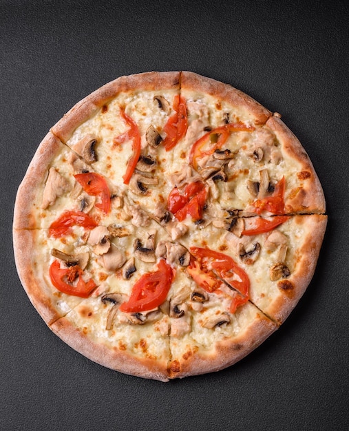 Delicious pizza with chicken tomatoes and cheese with salt and sauce