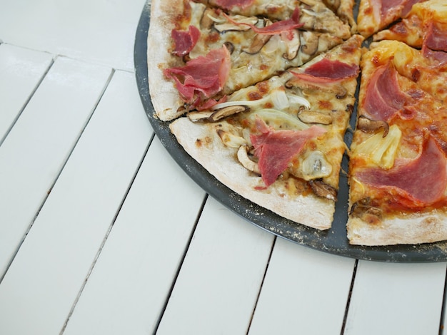 Delicious pizza on wooden table