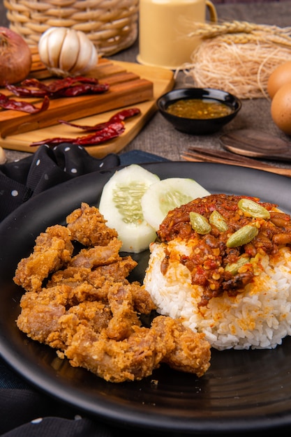 delicious pork belly rice or samcan goreng with rice combined with baby squid and petai Its characteristic food from North Sumatra  Medan