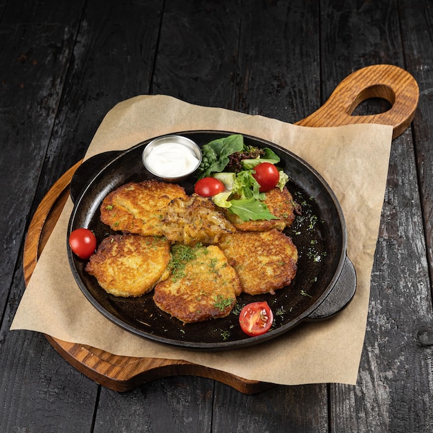 delicious potato fritters on a wooden table