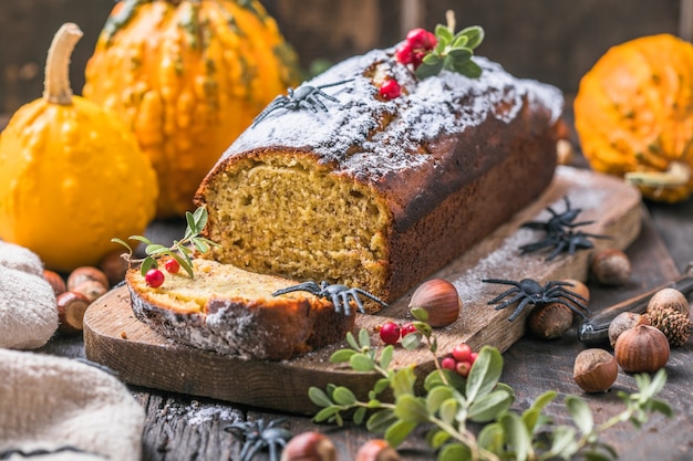 Delicious pumpkin cake on cutting board