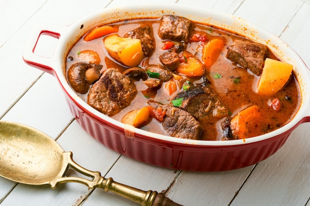 Delicious ragout with beef and mushrooms. Meat sauce with veal. Roast with mushrooms