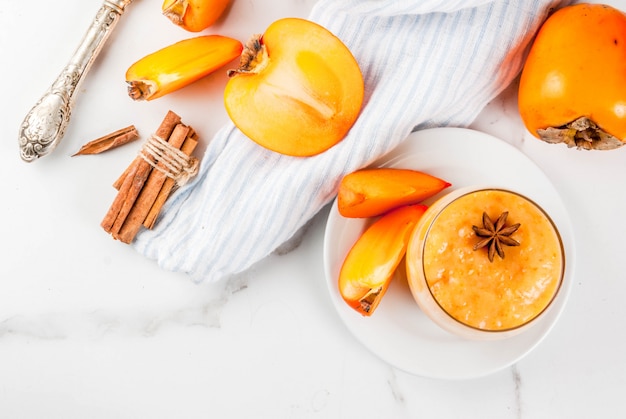 Delicious raw ripe persimmon fruit with persimmon smoothie