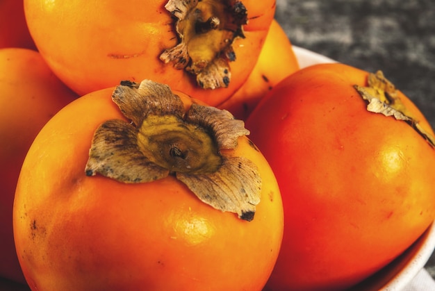 Delicious raw ripe persimmon fruits