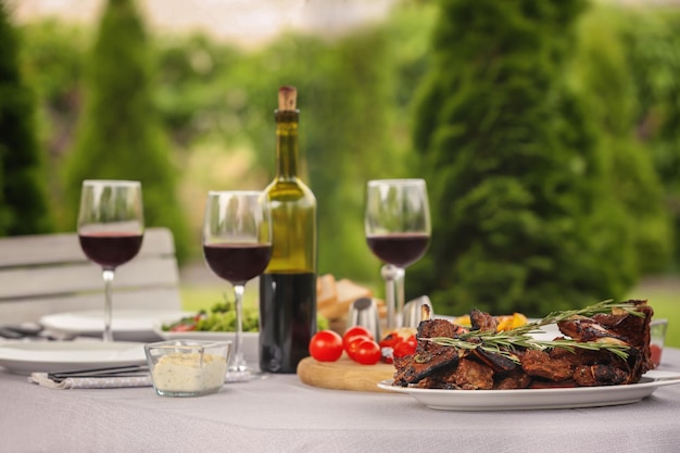 Delicious ribs served for dinner on table