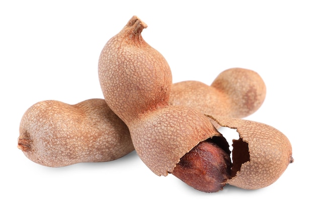 Delicious ripe tamarinds on white background Exotic fruit