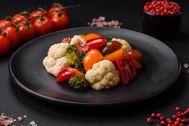 Delicious salad of fresh cherry tomatoes sweet peppers broccoli and cauliflower