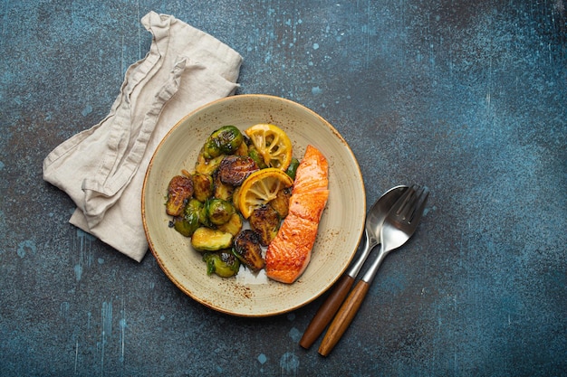 Delicious salmon fillet with grilled brussels sprouts on