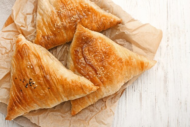 Delicious samosas on wooden table