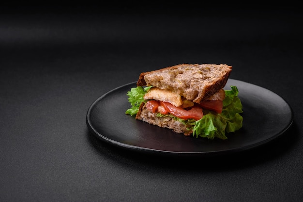 Delicious sandwich with crispy toast chicken tomatoes and lettuce