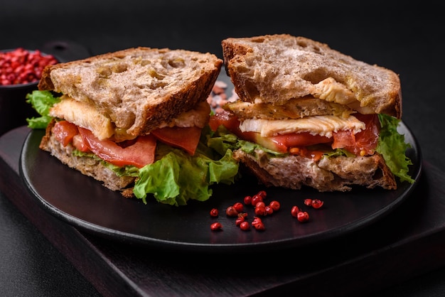 Delicious sandwich with crispy toast chicken tomatoes and lettuce