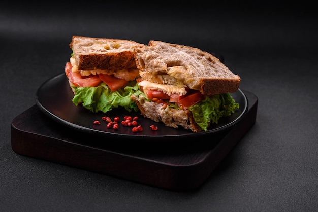 Delicious sandwich with crispy toast chicken tomatoes and lettuce