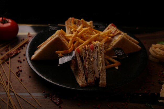 Delicious sandwich with french fries, breakfast meal.