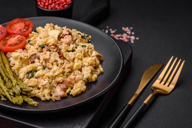 Delicious scramble with salmon sundried tomatoes spinach spices and herbs