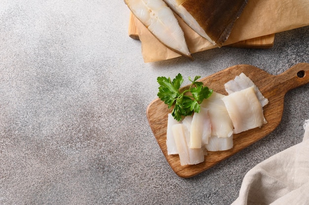 Delicious smoked halibut slices served fresh parsley