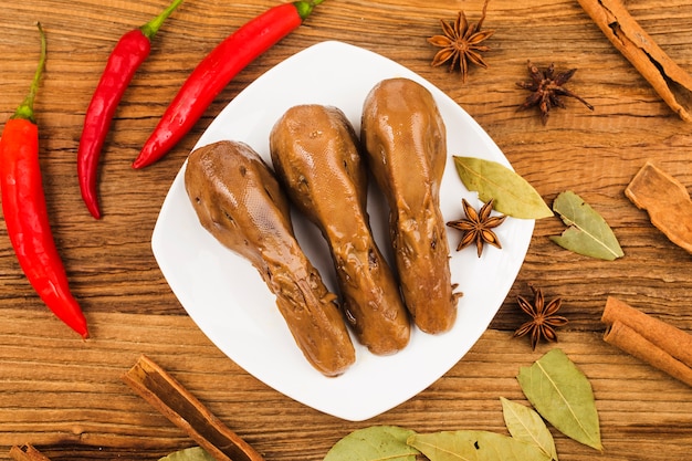 Delicious spiced duck head on a plate