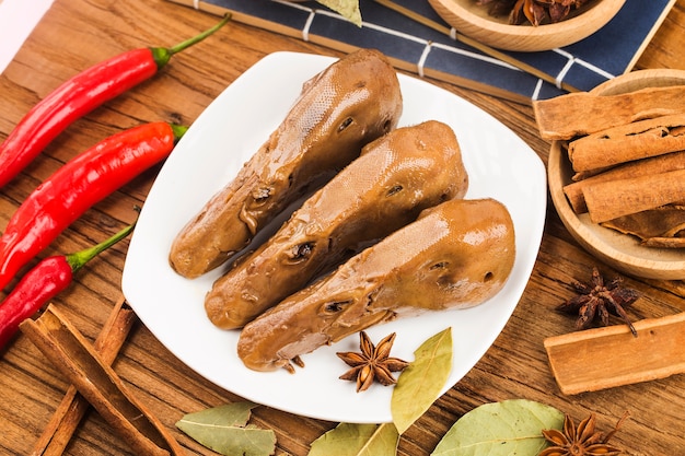 Delicious spiced duck head on a plate