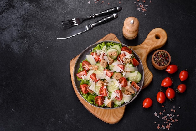 Delicious spring fresh vegetable salad with cherry tomatoes cucumber breadcrumbs and parmesan cheese