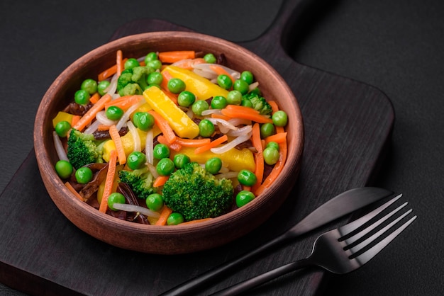 Delicious steamed vegetables broccoli mushrooms peas carrots and onions