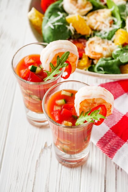 delicious summer gazpacho cocktail on a white wooden rustic background