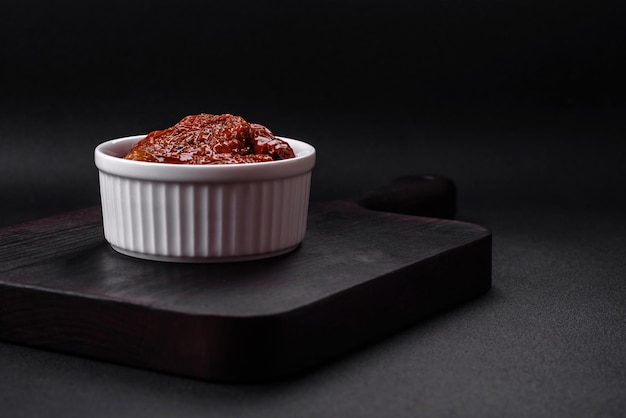 Delicious sun dried tomatoes in oil in a white ceramic bowl