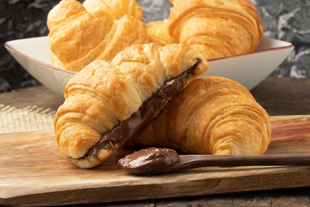 Delicious sweet croissant stuffed with hazelnut Selective focus