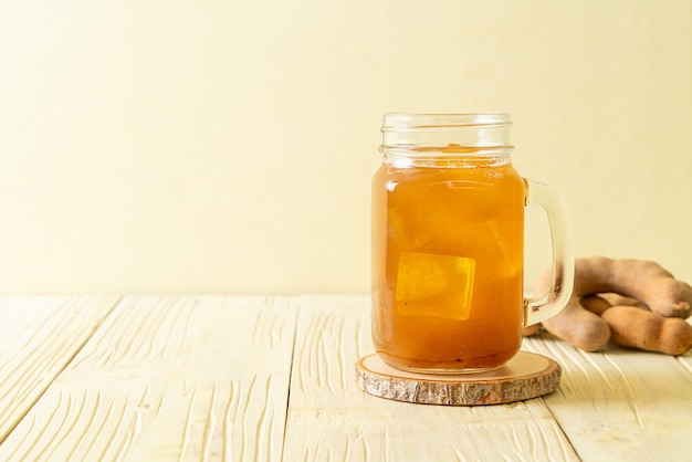 Delicious sweet drink tamarind juice and ice cube - healthy drink style