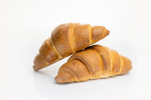 delicious sweet pastry croissant on white isolated background