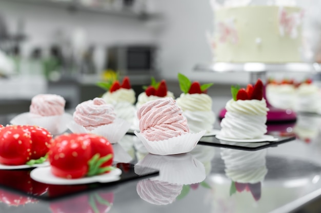 Delicious sweets on a black table