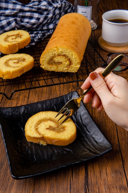 Delicious swiss roll roll cake or bolu gulung with pineapple jam 

Bolu Gulung is a sponge cake that is baked using a shallow pan filled with jam or butter cream and then rolled