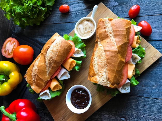 Delicious and Tasty sandwiches with turkey, ham, cheese, tomatoes