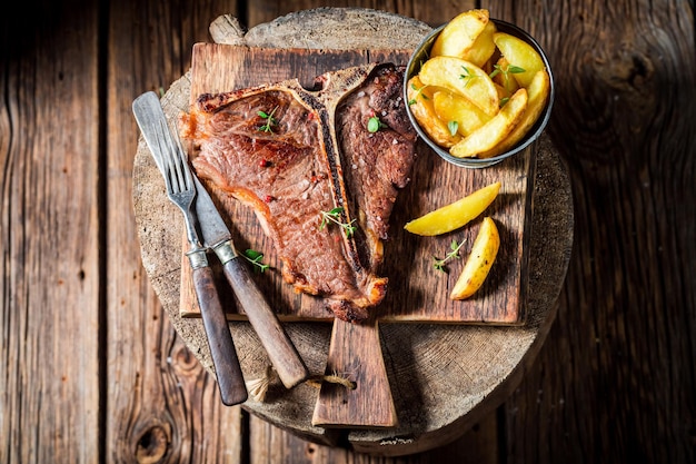 Delicious tbone steak and chips on the black rock