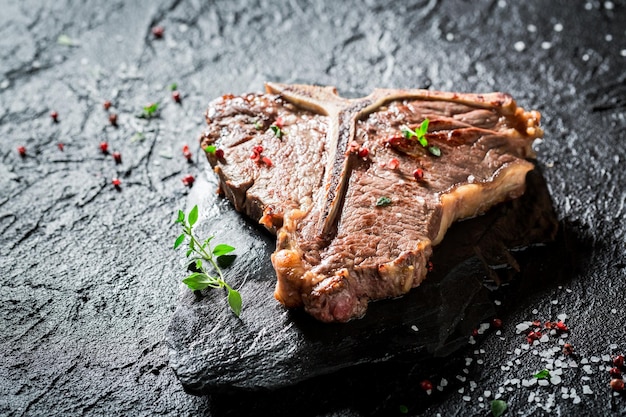 Delicious tbone steak with herbs salt and pepper