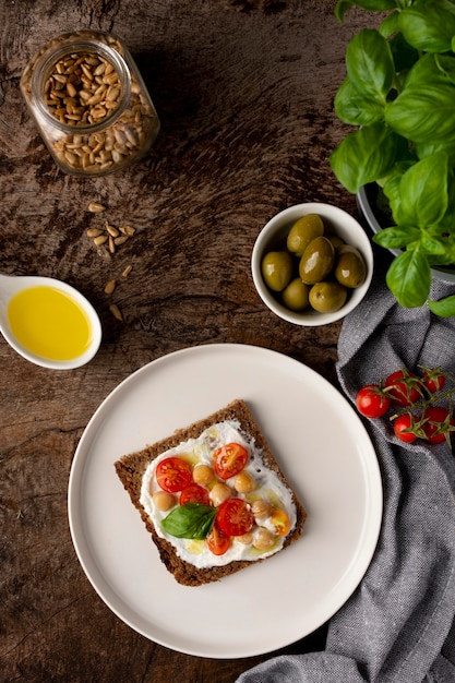 Delicious toast slice with cherry tomatoes flat lay